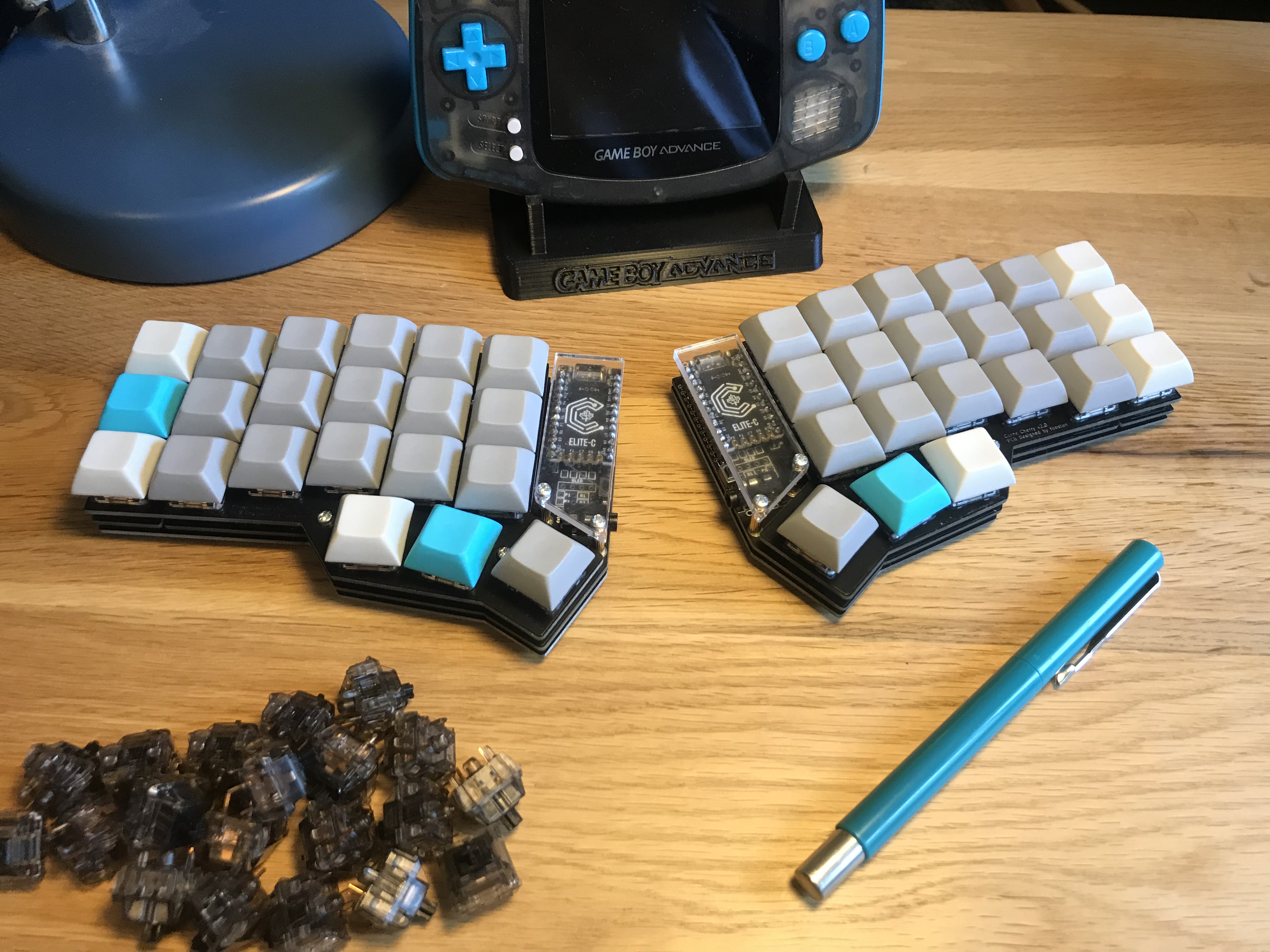 Unplugged CRKBD surrounded by colour-matching items